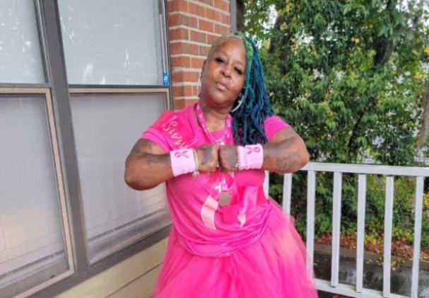 Lisette Davila wears pink as a breast cancer survivor thanking the doctors and staff at the UF Health Proton Therapy Institute